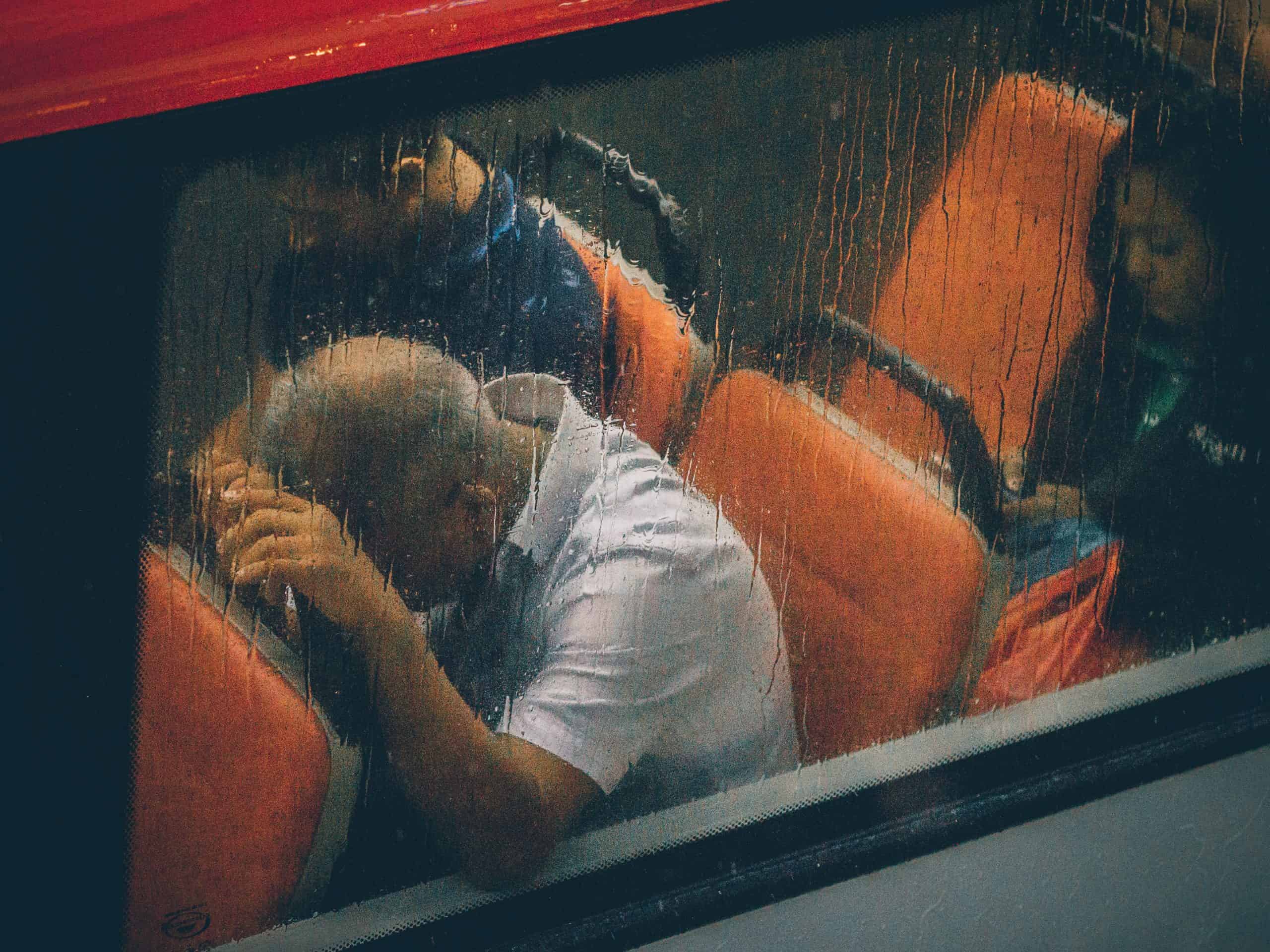  man on bus looking anxious on his way to work